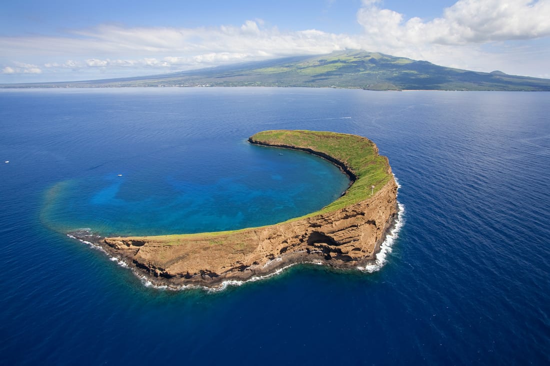 That's Molokini, off Maui, not hard to tell it's an ancient volcano cone now barely above the water
